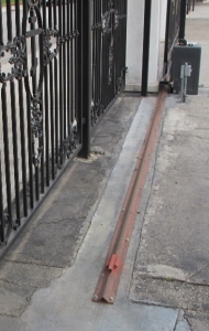 A sidewalk in front of a building
Description automatically generated